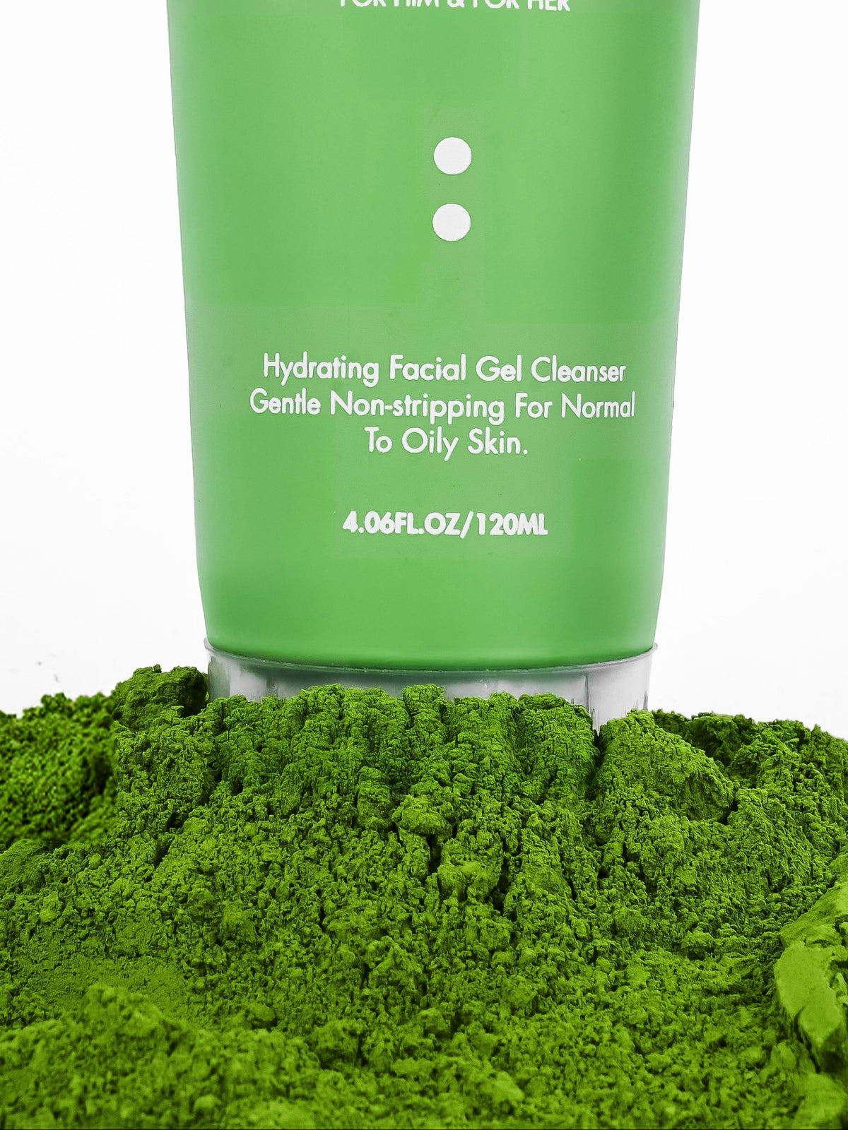 Just Cleanse tube standing on loose matcha powder